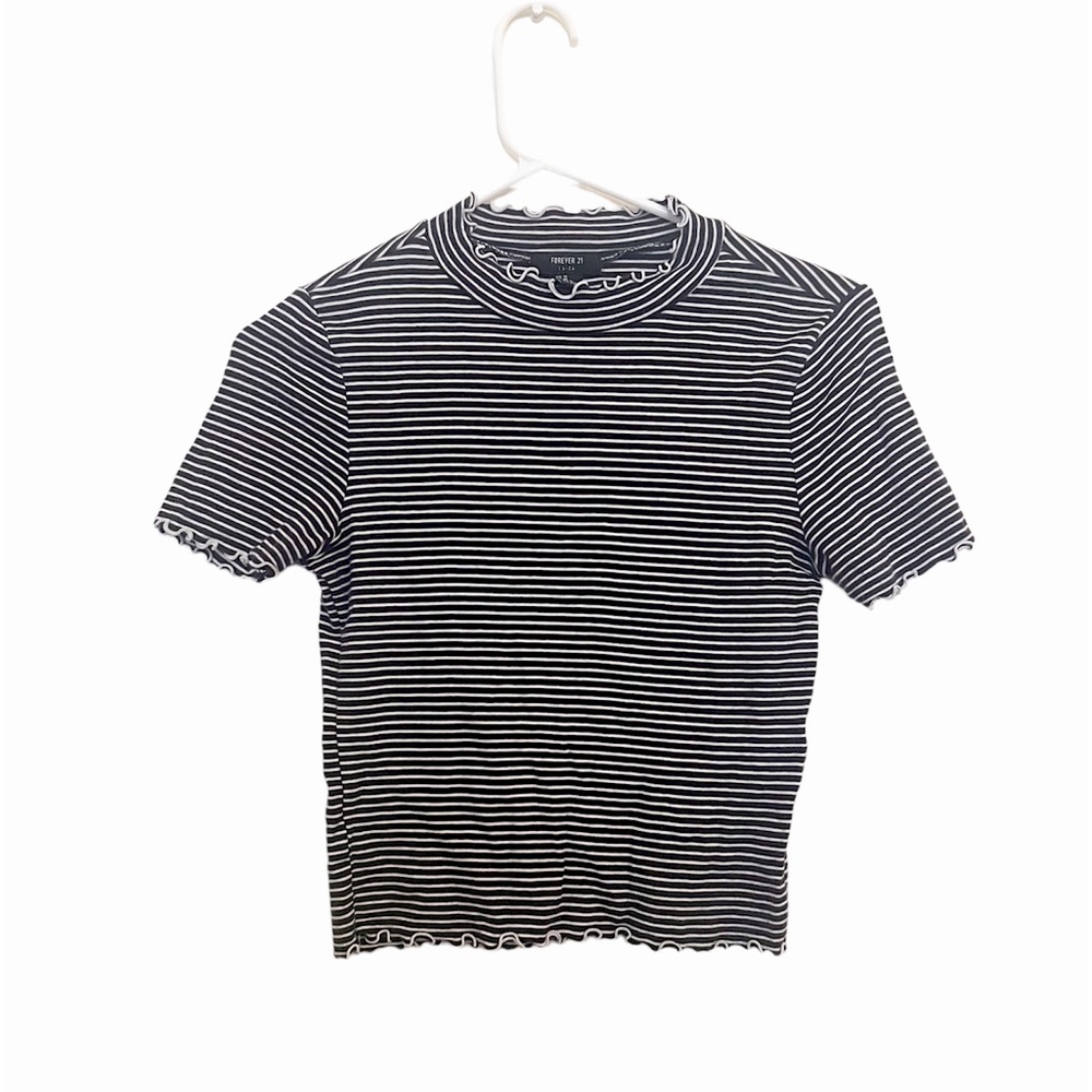 Black and white short top with curly ends. Top has been worn at least 3-4 times.